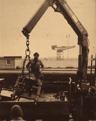 2010.88_crop.jpg; 2010.88; Slide: Printing press being lifted by crane; Photographic slide